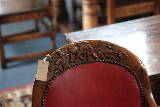 A set of six mid 19th century Anglo Indian carved padouk elbow chairs, W.2ft H.3ft 1in.